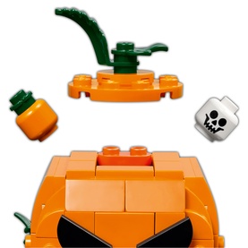 Lego Jack-O'-Lantern Pickup Truck Halloween Set close-up showing orange brick cab, pumpkin stem topper, mini pumpkin, and skull tile piece
