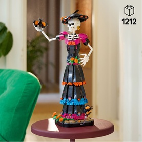 Lego Ideas skeleton figure in black dress with colourful floral details, holding a butterfly, Day of the Dead themed build