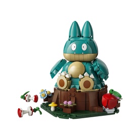 Lego Pok&eacute;mon large teal Munchlax figure on tree stump base with small mushroom and flower accessories, multi-coloured