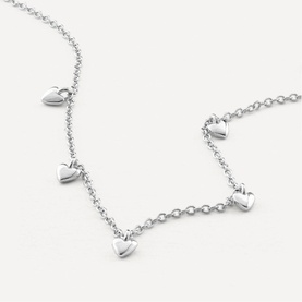 Juvi silver-tone chain necklace with five dangling puffed heart charms evenly spaced along the front