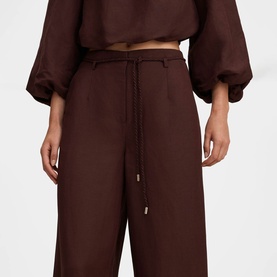 Model wearing Forever New chocolate wide-leg drawstring trousers, styled with matching chocolate balloon-sleeve crop top.
