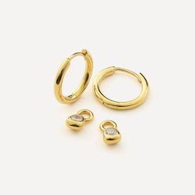 Juvi gold hoop earrings with detachable heart charm pendants featuring crystal embellishments, displayed as a set