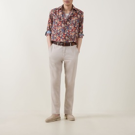 Model wearing Paul Smith Red Single Cuff Slim floral cotton shirt, styled with stone chinos, brown belt and tan suede loafers
