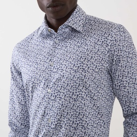 Model wearing Paul Smith white slim fit formal shirt with allover dark floral print, spread collar, single cuff, 100% cotton