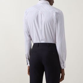 Model wearing Paul Smith Multi Blue striped slim fit single cuff cotton shirt, styled with navy tailored trousers, rear view.