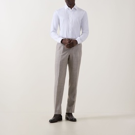 Model wearing Paul Smith Solid Single-Cuff Shirt in white, styled with light grey tailored trousers and black leather shoes.