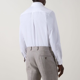 Model wearing Paul Smith Solid Single-Cuff Shirt in white, back view, styled with light grey tailored trousers.