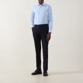 Model wearing Paul Smith Solid Single-Cuff Shirt in blue with classic collar, styled with navy trousers and black leather shoes.