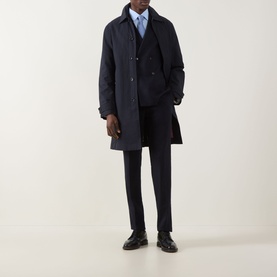 Model wearing Paul Smith Blue Solid Single-Cuff Shirt, styled with navy double-breasted coat, navy trousers, and black leather shoes.