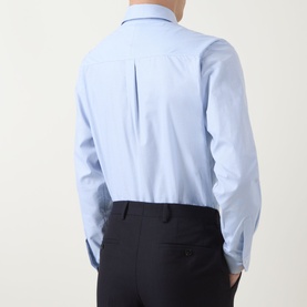 Model wearing Paul Smith Blue Single Cuff Slim formal shirt, rear view, styled with dark navy trousers