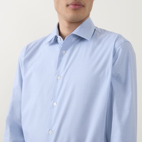 Model wearing Paul Smith Blue Single Cuff Slim formal shirt, 100% cotton, featuring a cutaway collar and front button placket.