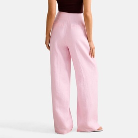 Model wearing Forever New Candy Hearts wide-leg trousers with high waist, styled with a dark cropped top.