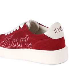 Kurt Geiger London red suede sneaker with embroidered Kurt script, white sole and heel tab, angled rear view
