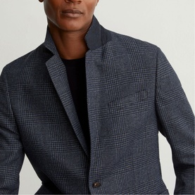 Model wearing Reiss blue glen check blazer with notch lapels and chest pocket, styled over a black crew-neck top