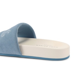 Kurt Geiger London blue suede slide sandal, white embossed logo footbed and light blue sole, angled rear view