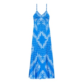 Blue and white bandana-print maxi slip dress with spaghetti straps, V-neckline, and flared hem