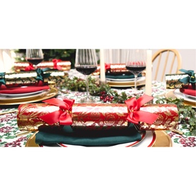Celebration Crackers 8 Pack Traditional Christmas Crackers in red and gold botanical design with satin bow, styled on a festive table setting