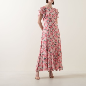 Model wearing Queens of Archive Greta Antique Rose Dress in Antique Rose Garden, maxi length with flutter sleeves and floral print, styled with