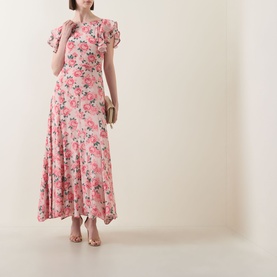Model wearing Queens of Archive Greta Antique Rose Dress in Antique Rose Garden, maxi length with flutter sleeves and godet skirt, styled with gold
