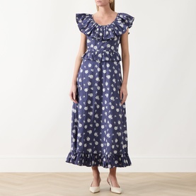 Model wearing Queens of Archive Devon Prairie Floral Dress in Prairie Rose Blue with frill neck, peplum waist and frill hem midi skirt