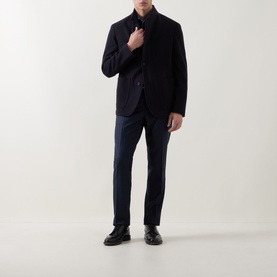Model wearing Corneliani Stand-Collar Wool Jacket in navy, styled with matching navy trousers and black leather shoes.