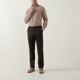Model wearing Corneliani Herringbone Tonal Striped Shirt in beige with dark brown trousers and tan suede loafers.