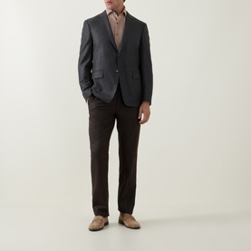 Model wearing Corneliani Herringbone Tonal Striped Shirt in beige, styled with charcoal blazer, dark brown trousers and beige suede shoes.