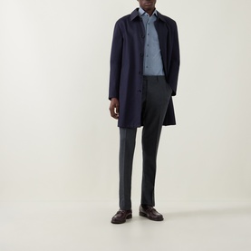 Model wearing Corneliani Herringbone Tonal Striped Shirt in mid blue, styled with navy coat and dark trousers.