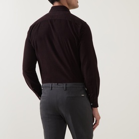 Model wearing dark burgundy long-sleeve shirt, styled with grey slim-fit trousers, rear view