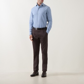 Model wearing Corneliani light blue cotton casual shirt with dark brown trousers and black leather shoes.