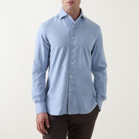 Model wearing Corneliani light blue cotton casual shirt with spread collar and button placket, styled with dark brown trousers