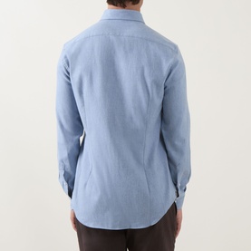 Model wearing Corneliani light blue cotton casual shirt, rear view, with brown trousers