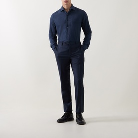 Model wearing Corneliani Soft-Touch Regular Fit Casual Shirt in navy, long sleeves, pointed collar, styled with navy trousers and black shoes.