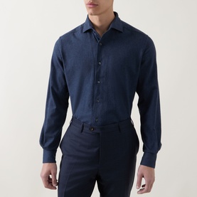 Model wearing Corneliani Soft-Touch Regular Fit Casual Shirt in navy, long sleeves, pointed collar, button fastenings, styled with navy trousers.