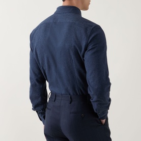 Model wearing Corneliani Soft-Touch Regular Fit Casual Shirt in navy, rear view, paired with navy trousers.