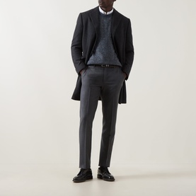 Model wearing Corneliani Chunky Knit Sweater in blue with crew neck, styled with dark overcoat, charcoal trousers and black leather shoes.
