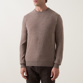 Model wearing Corneliani Logo Knitted Sweater in taupe, crew neck, ribbed trims, wool-cashmere blend, styled with dark trousers.
