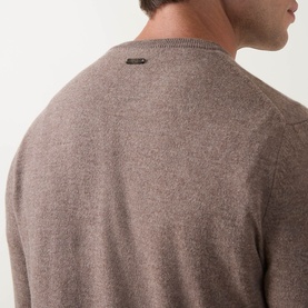 Model wearing Corneliani Logo Knitted Sweater in taupe, close-up of rear logo detail on wool-cashmere crew neck knit.
