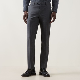 Model wearing Corneliani Straight Leg Formal Trousers in grey with pressed creases, styled with a blue shirt and black leather shoes.
