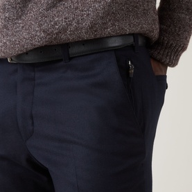 Model wearing Corneliani Straight Leg Formal Trousers in navy wool, with zip side pocket detail and black leather belt visible.
