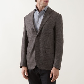 Model wearing Corneliani brown houndstooth wool blazer jacket, styled with a light blue shirt and dark trousers.