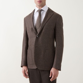 Model wearing Corneliani Boucle Checked Single-Breasted Blazer in brown wool, styled with white shirt and grey tie.