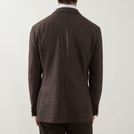 Model wearing Corneliani Boucle Checked Single-Breasted Blazer in brown wool, rear view showing centre vent and houndstooth pattern
