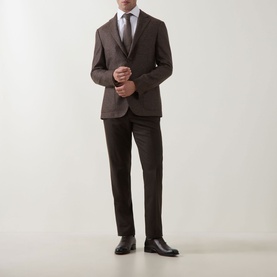 Model wearing Corneliani Boucle Checked Single-Breasted Blazer in brown, styled with matching trousers, white shirt, and grey tie.