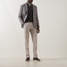 Model wearing Corneliani stone wool check blazer, styled with dark knit, white shirt, beige trousers and dark suede shoes.