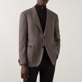 Model wearing Corneliani brown virgin wool and silk blazer jacket with check pattern, styled with black roll-neck jumper.