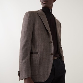Model wearing Corneliani brown virgin wool and silk blazer jacket, styled with black turtleneck and dark trousers