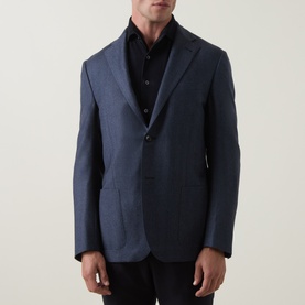 Model wearing Corneliani mid blue virgin wool jacket with notch lapels and two-button fastening, styled with black shirt and trousers