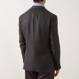 Model wearing Corneliani Hopsack Single-Breasted Blazer in brown wool-silk-cashmere blend, rear view, styled with light blue shirt and brown trousers.