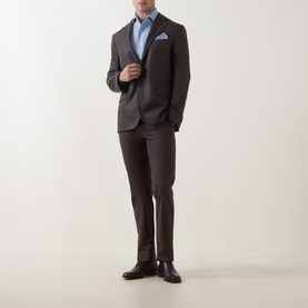Model wearing Corneliani Hopsack Single-Breasted Blazer in brown, styled with blue shirt, brown trousers, and black leather shoes.